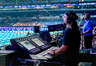 Caleb Cassler mixing audio for the event on the DiGiCo SD12-96 desk